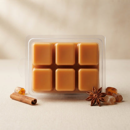 Clamshell of soy wax melt cubes in cozy, woodsy and spiced fall and winter scents