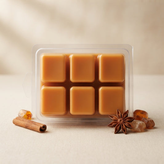 Clamshell of soy wax melt cubes in cozy, woodsy and spiced fall and winter scents