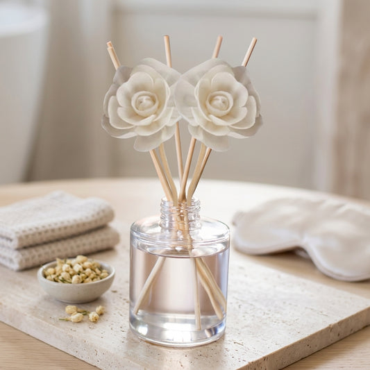Flameless reed diffuser bottle with reeds, hand-poured in California — warm vanilla home fragrance