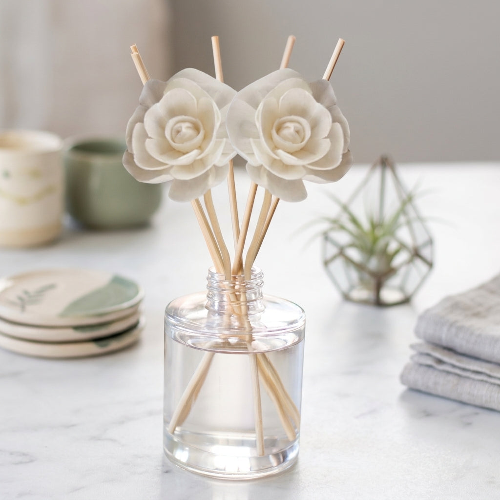 Reed diffuser bottle with reeds, in crisp linen and cotton scents